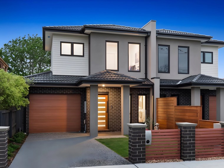 Front of the Bentleigh East side by side townhouses at dusk