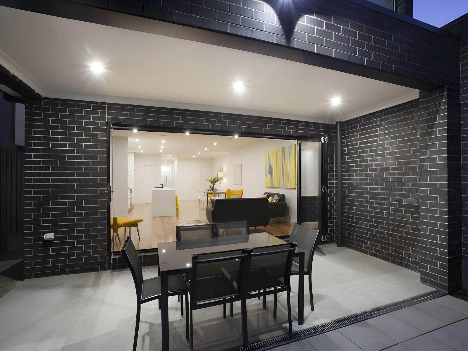 Covered outdoor area opening to the living room in the Glen Huntly townhouses
