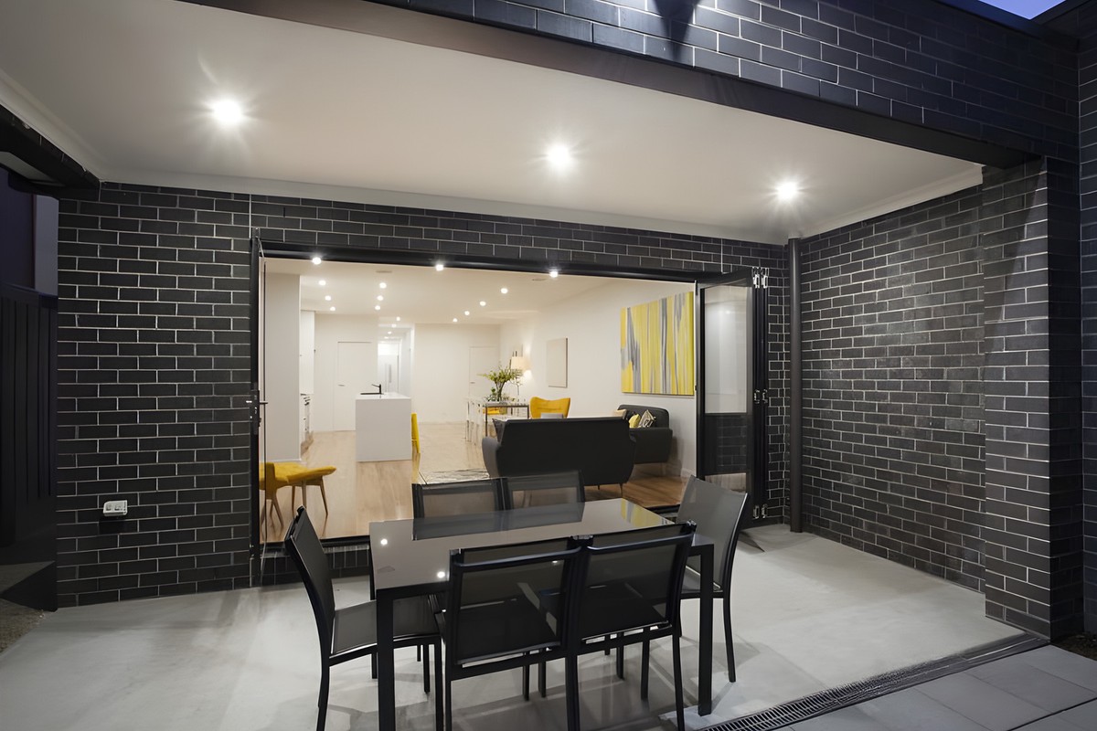 Covered outdoor area opening to the living room in the Glen Huntly townhouses