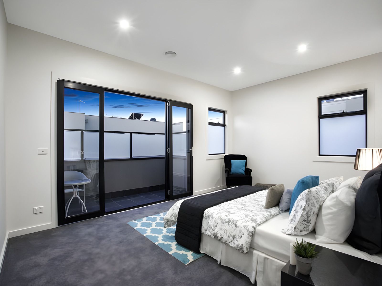 Bedroom opening to a balcony in the Glen Huntly townhouses