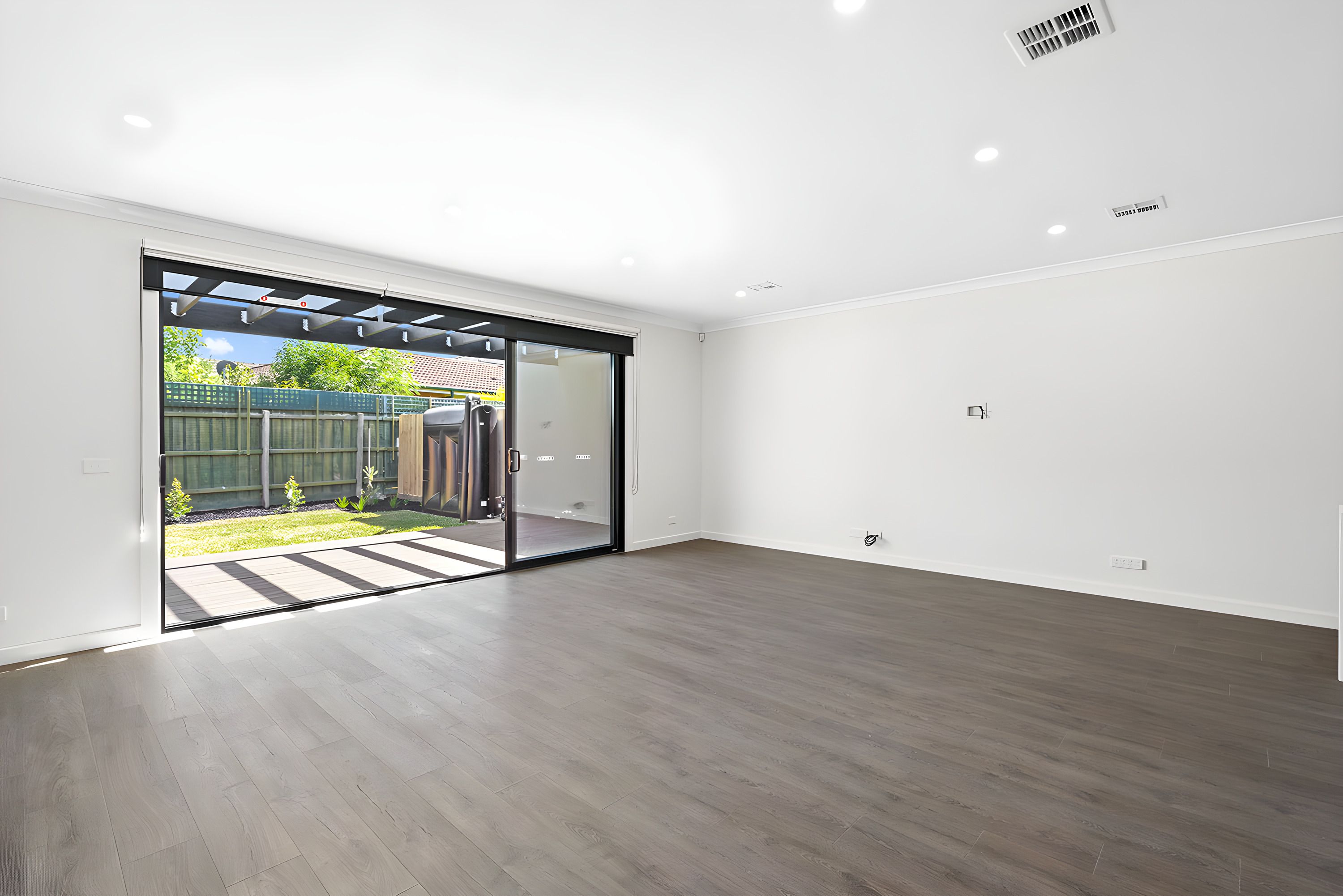 Living room opening to the yard in the Moorabbin side by side townhouses