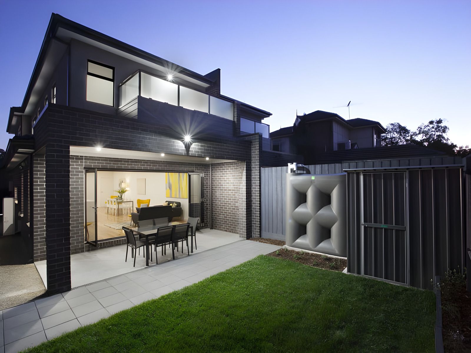 Rear of the Glen Huntly townhouses and the back garden at dusk