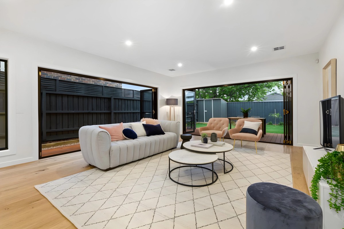 Living room opening to the deck in the Bentleigh East townhouses