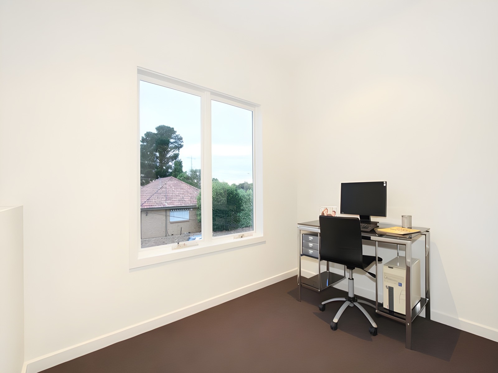 Study with a desk by the window in a dual occupancy we built