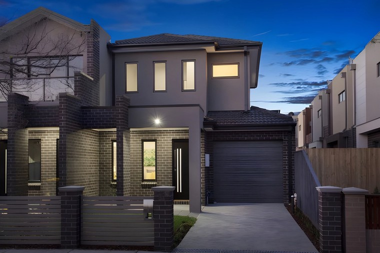 Front of the Glen Huntly side by side townhouses at dusk
