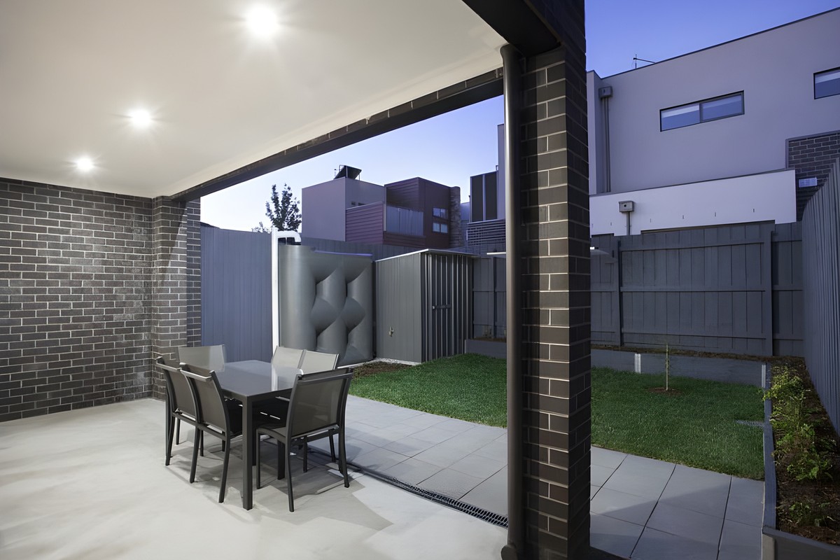 Covered outdoor area and back garden of the Glen Huntly townhouses
