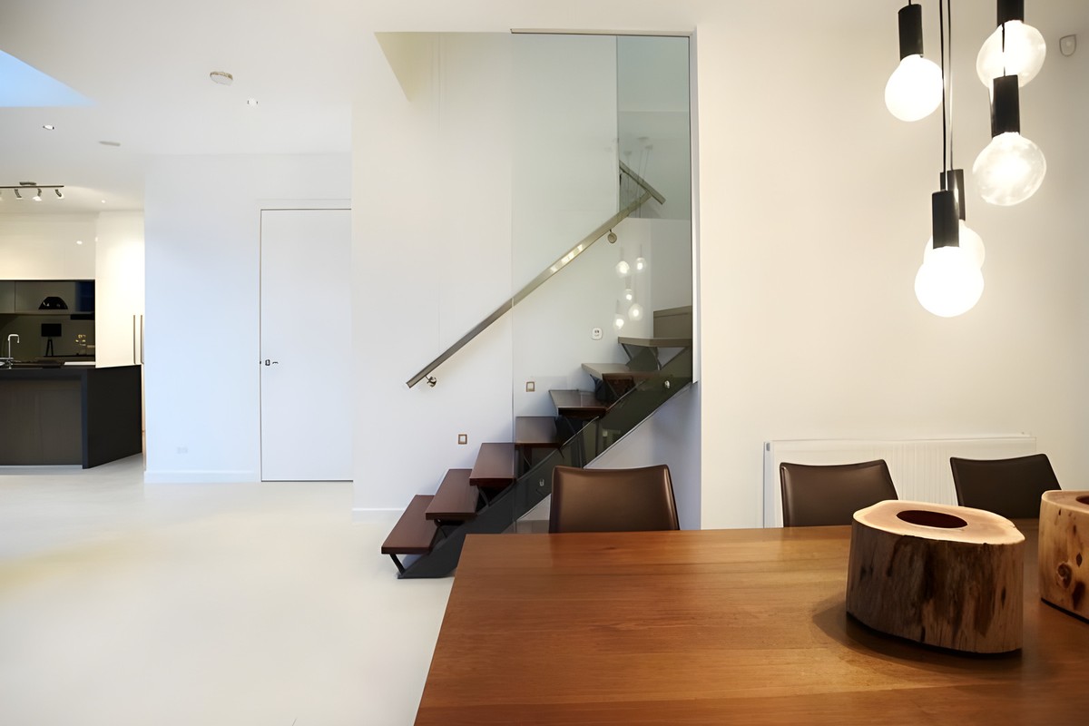 Dining table under pendant lights in the Beaumaris renovation