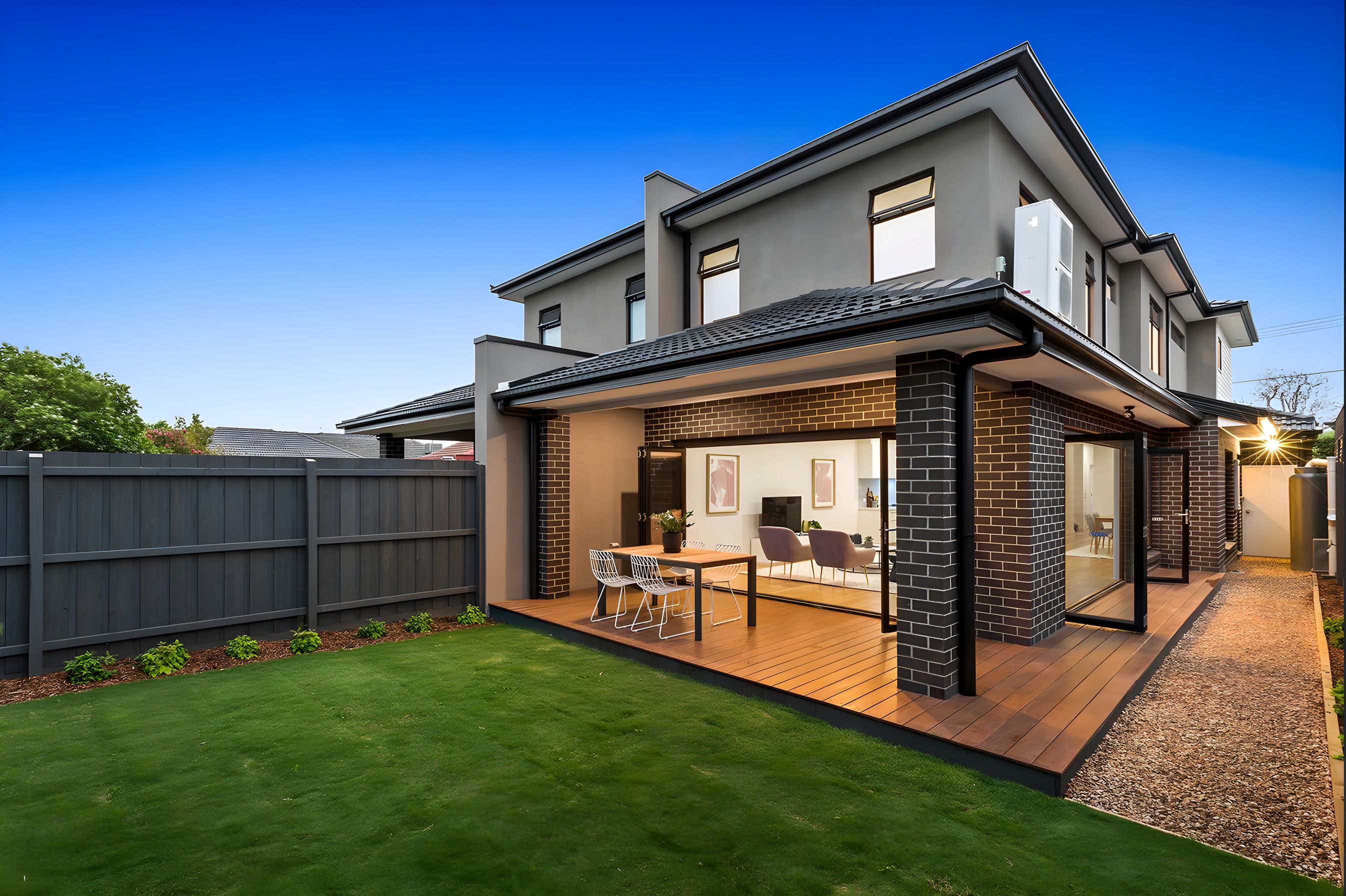 Rear deck and back garden of the Bentleigh East townhouses at dusk