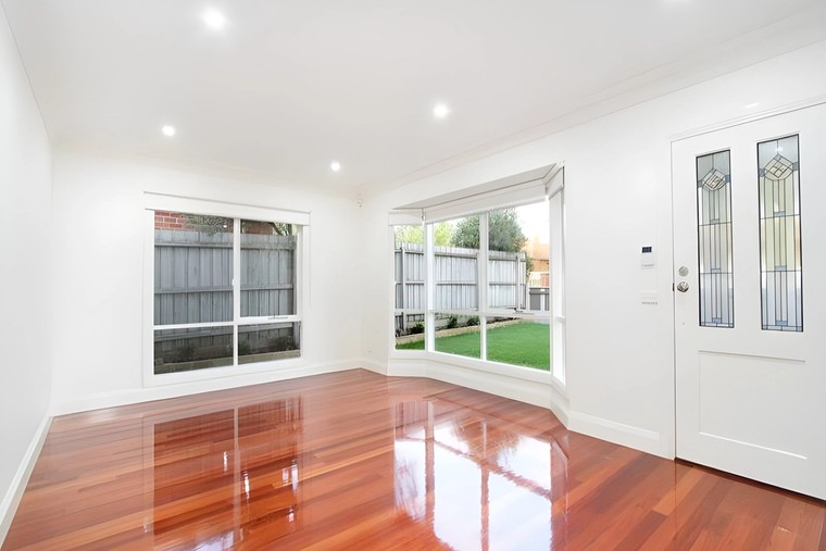 Living room with polished timber floorboards in townhouses we built