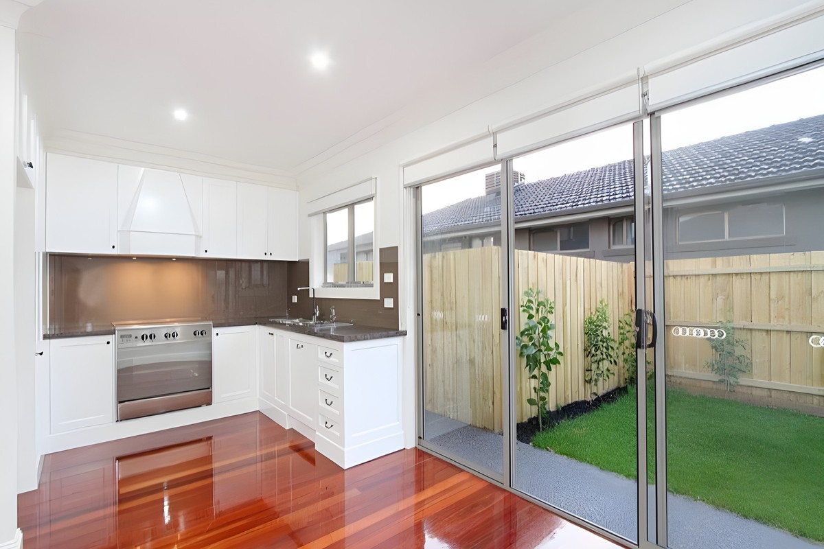 Kitchen opening to the garden in the Oakleigh townhouses