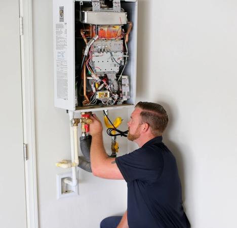 Our technician performing a water heater installation for a client in Temecula, CA