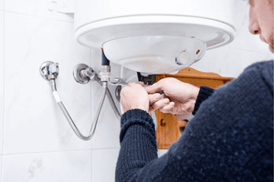 Guardian plumber fixing hot water heater.