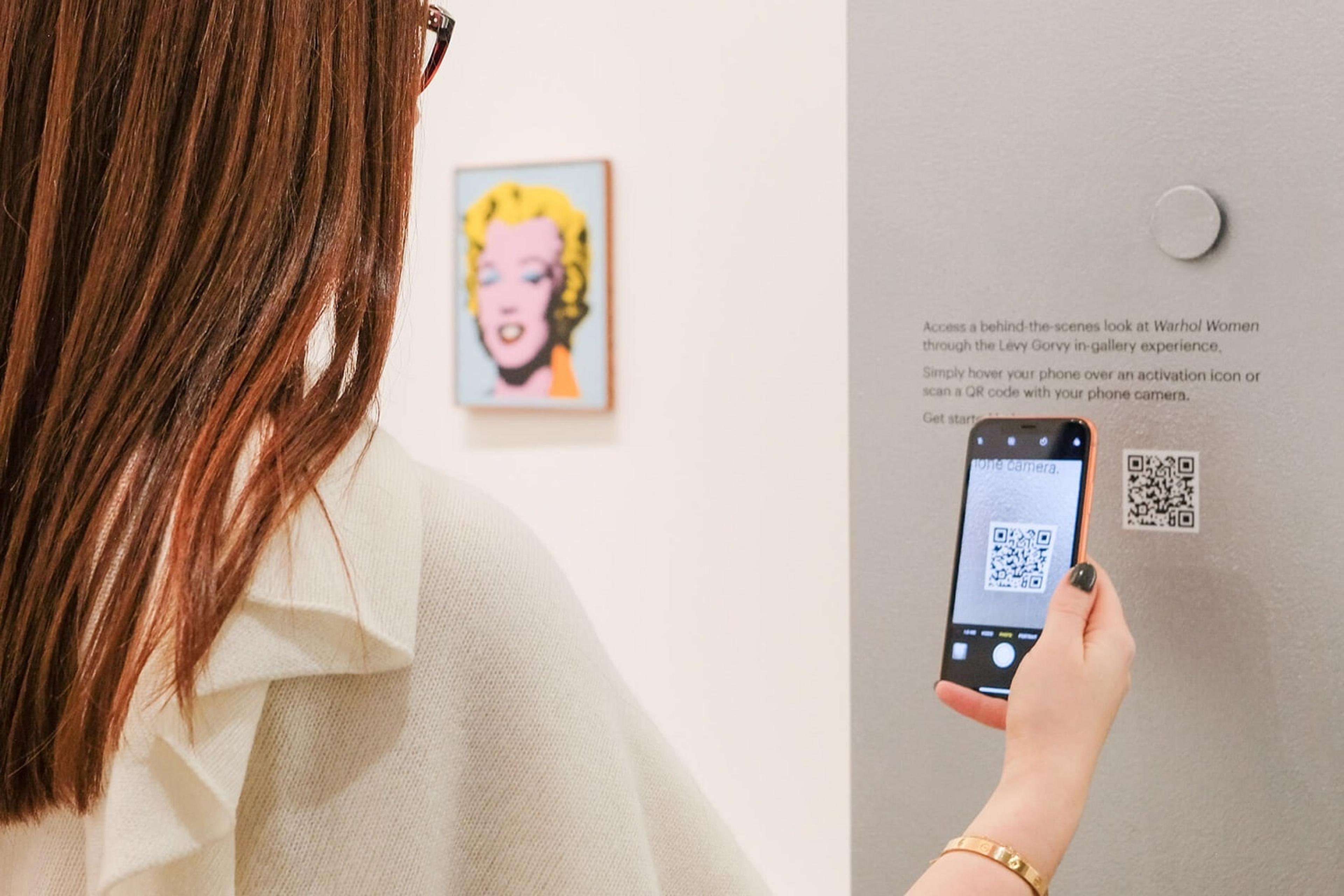 Person scanning QR code in an event