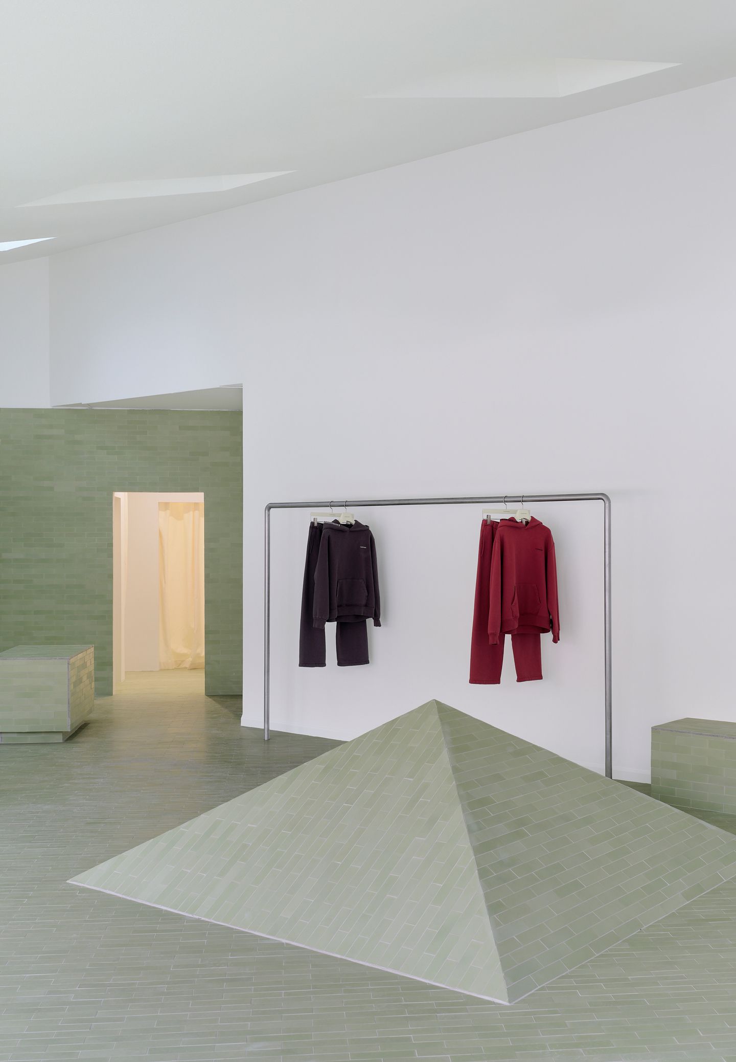 two clothes are hanging on a rack in a store