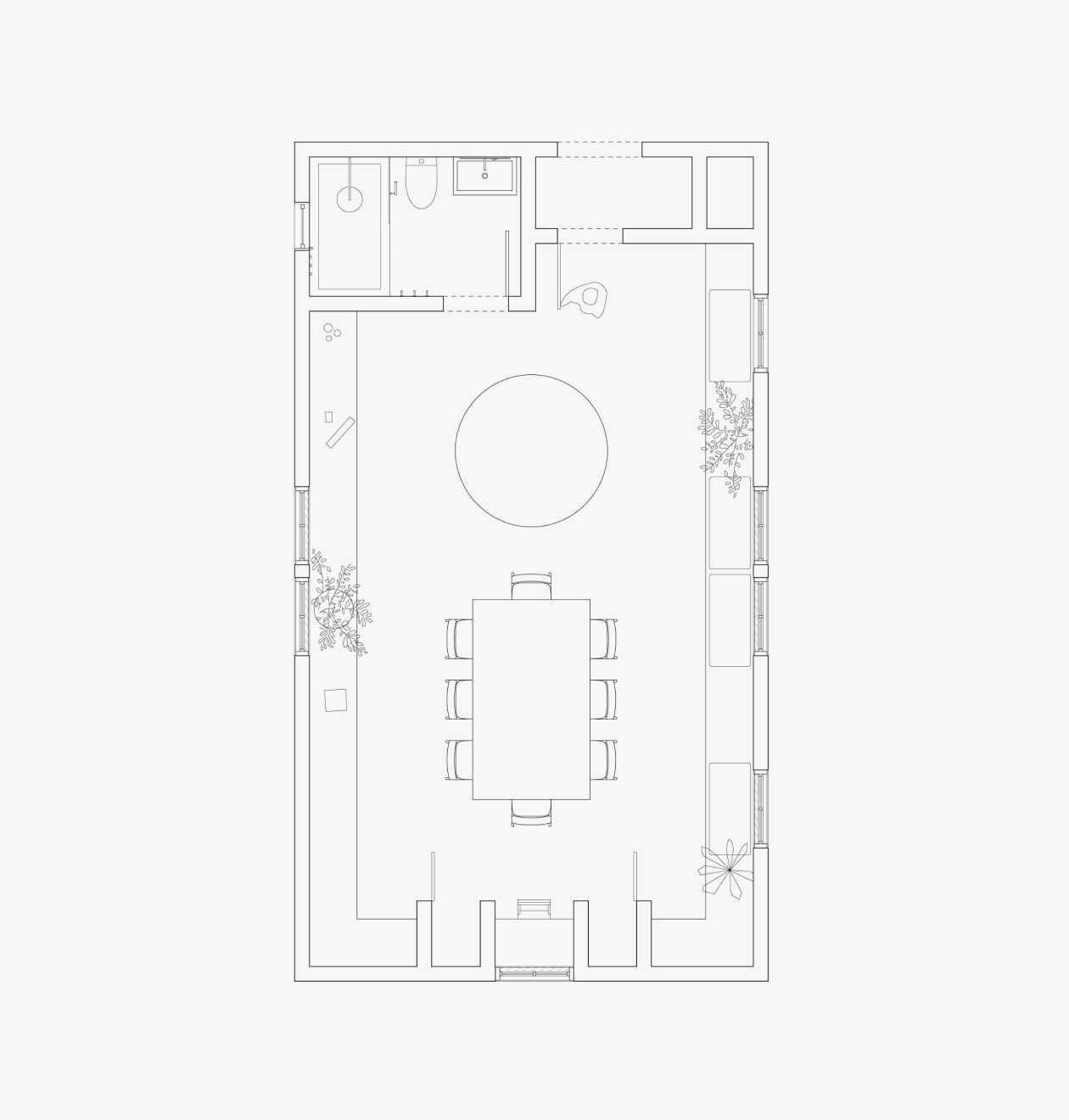 a black and white floor plan of a house with a dining table and chairs .