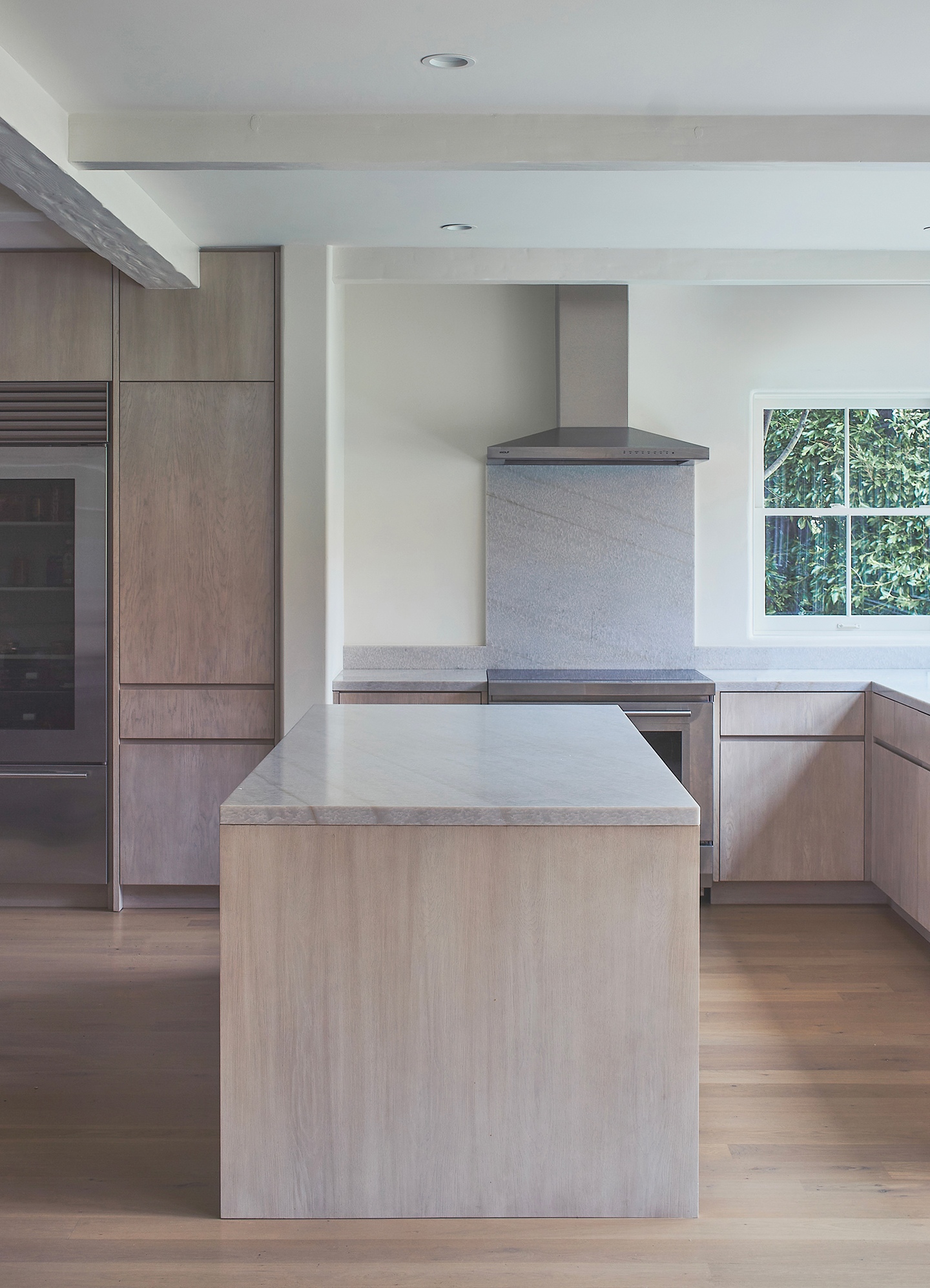 a kitchen with stainless steel appliances and wooden cabinets