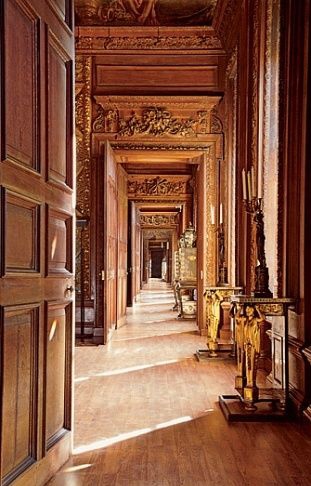 a hallway in a building with a door open