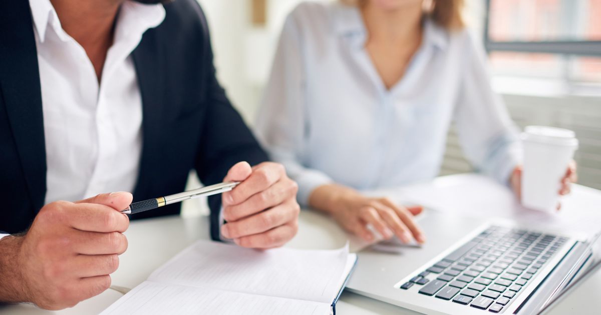 Two people sitting at computer