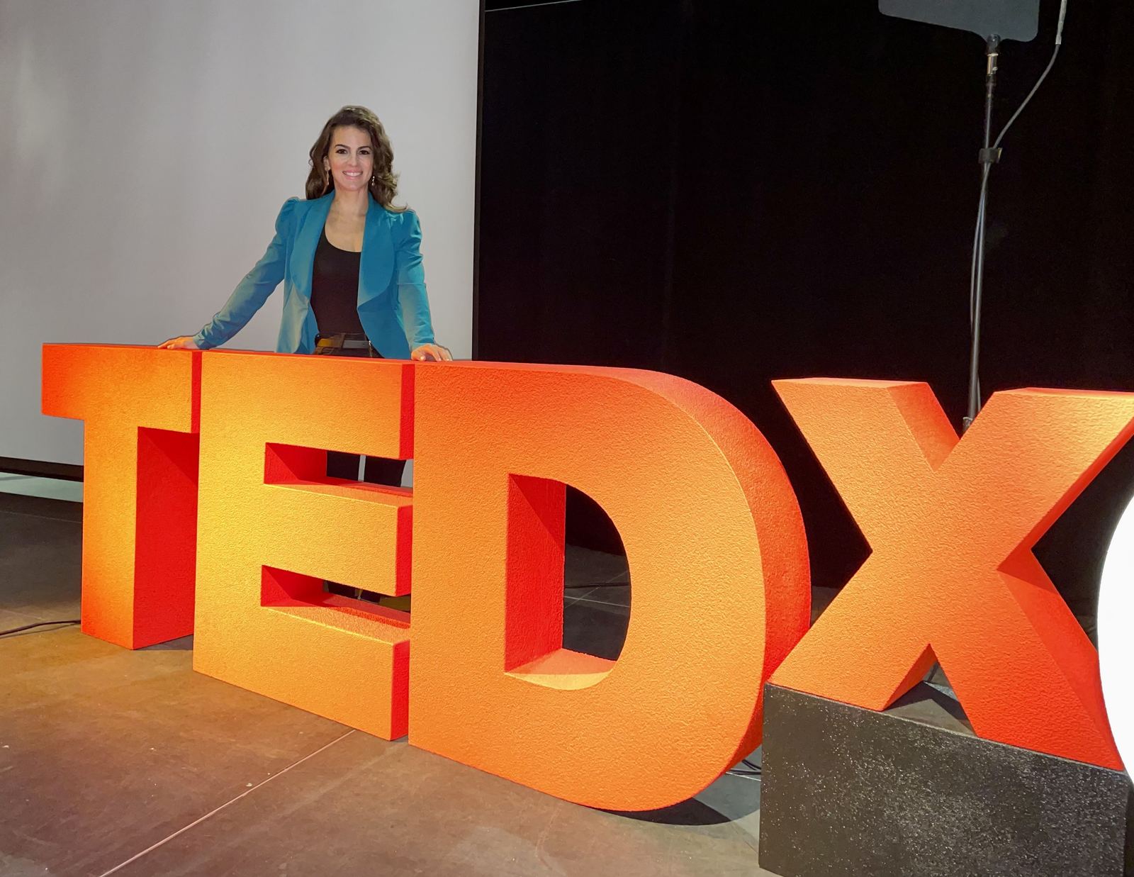 Renée Marino delivering her TEDx talk
