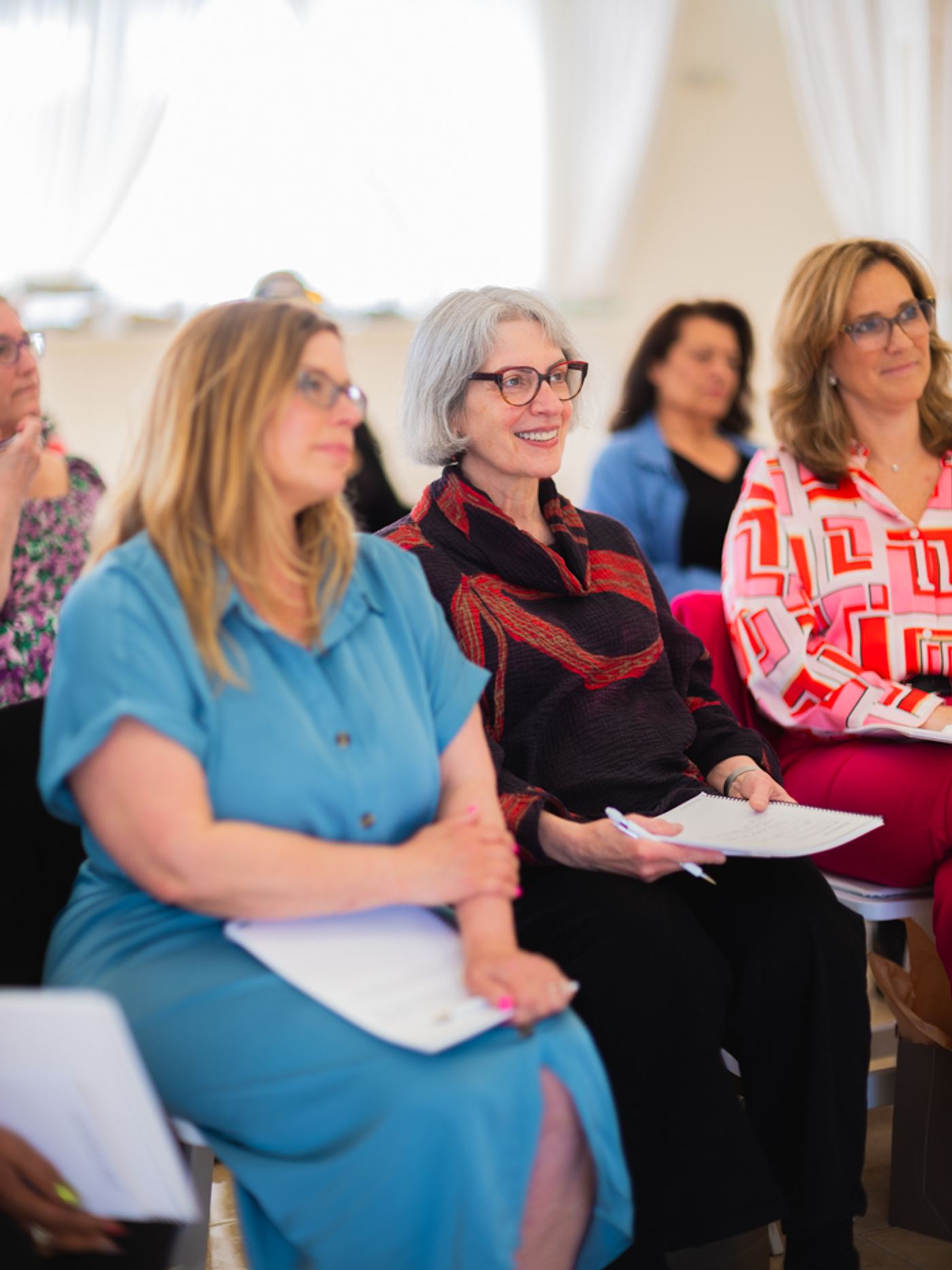 Attendees listening during a Renée Marino training session