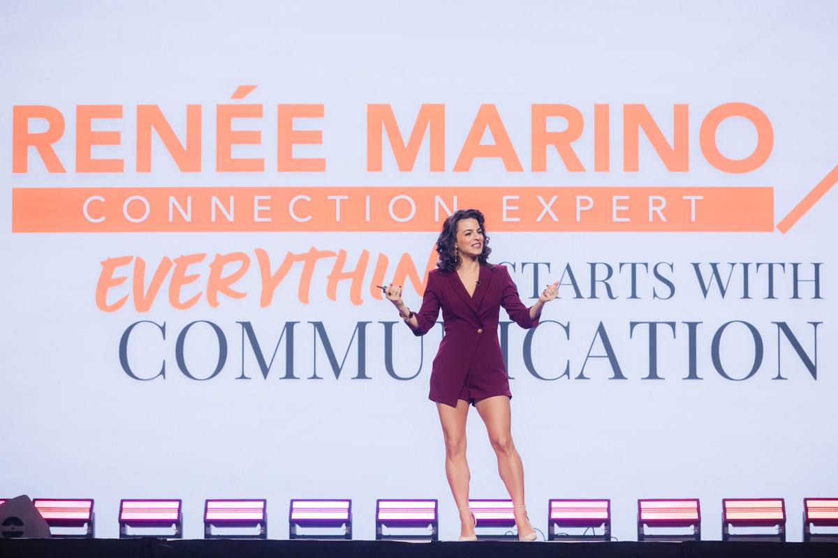 Renée Marino delivering a keynote on her branded communication stage