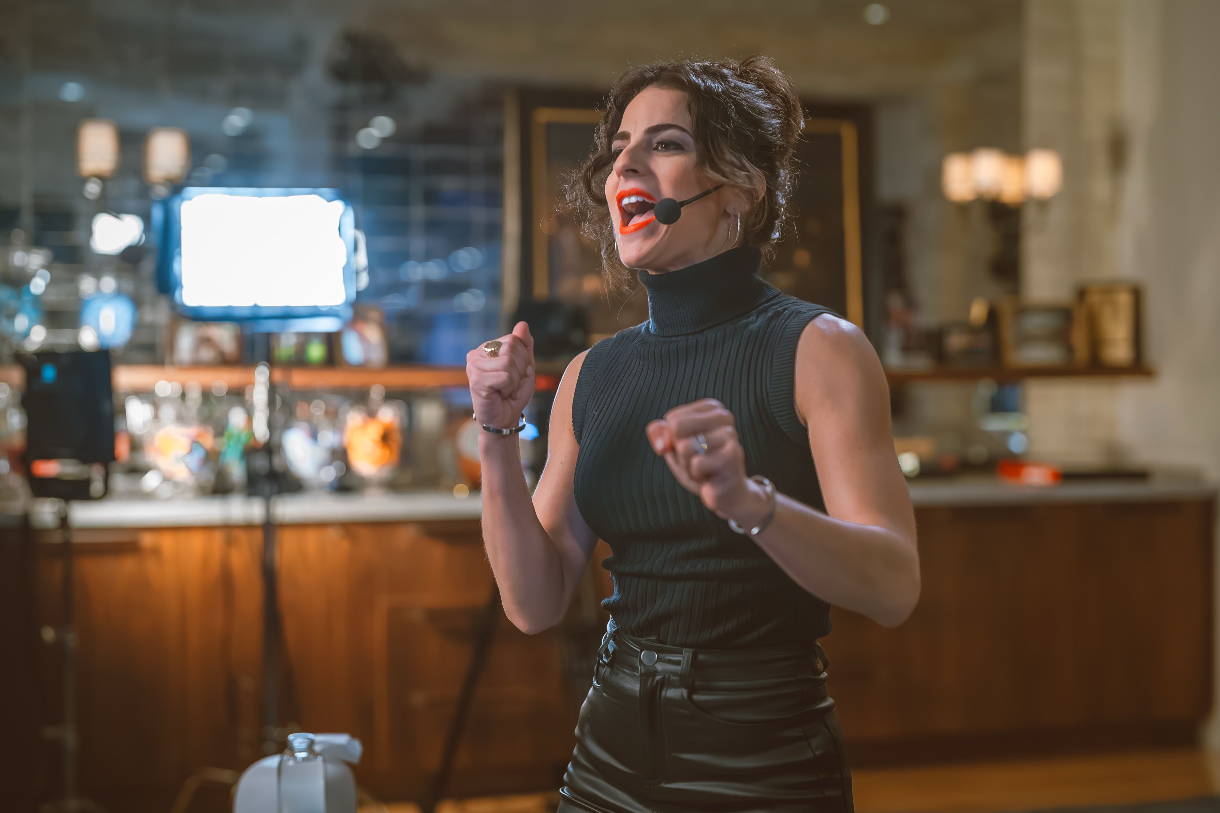 Renée on a broadcast set with run of show