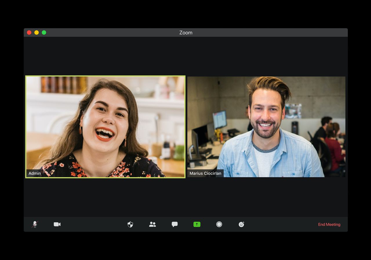 Screenshot of a two-person Zoom video call, both participants smiling.