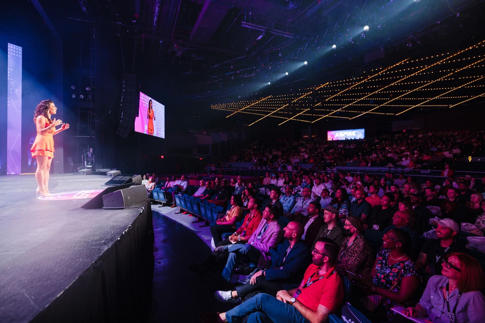 Renée Marino speaking at Madison Square Garden on the Aspire Tour
