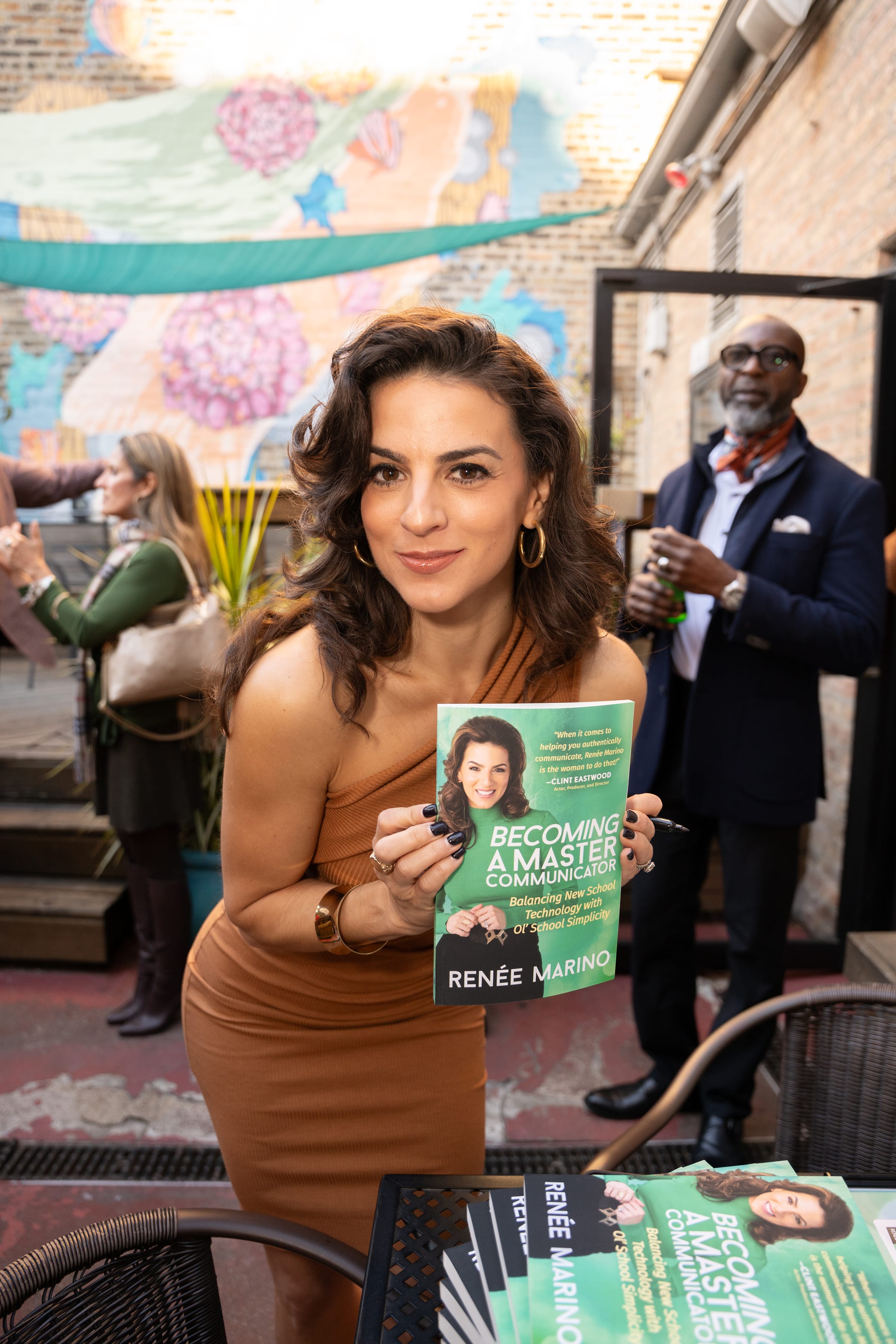 Renée Marino signing copies of Becoming a Master Communicator
