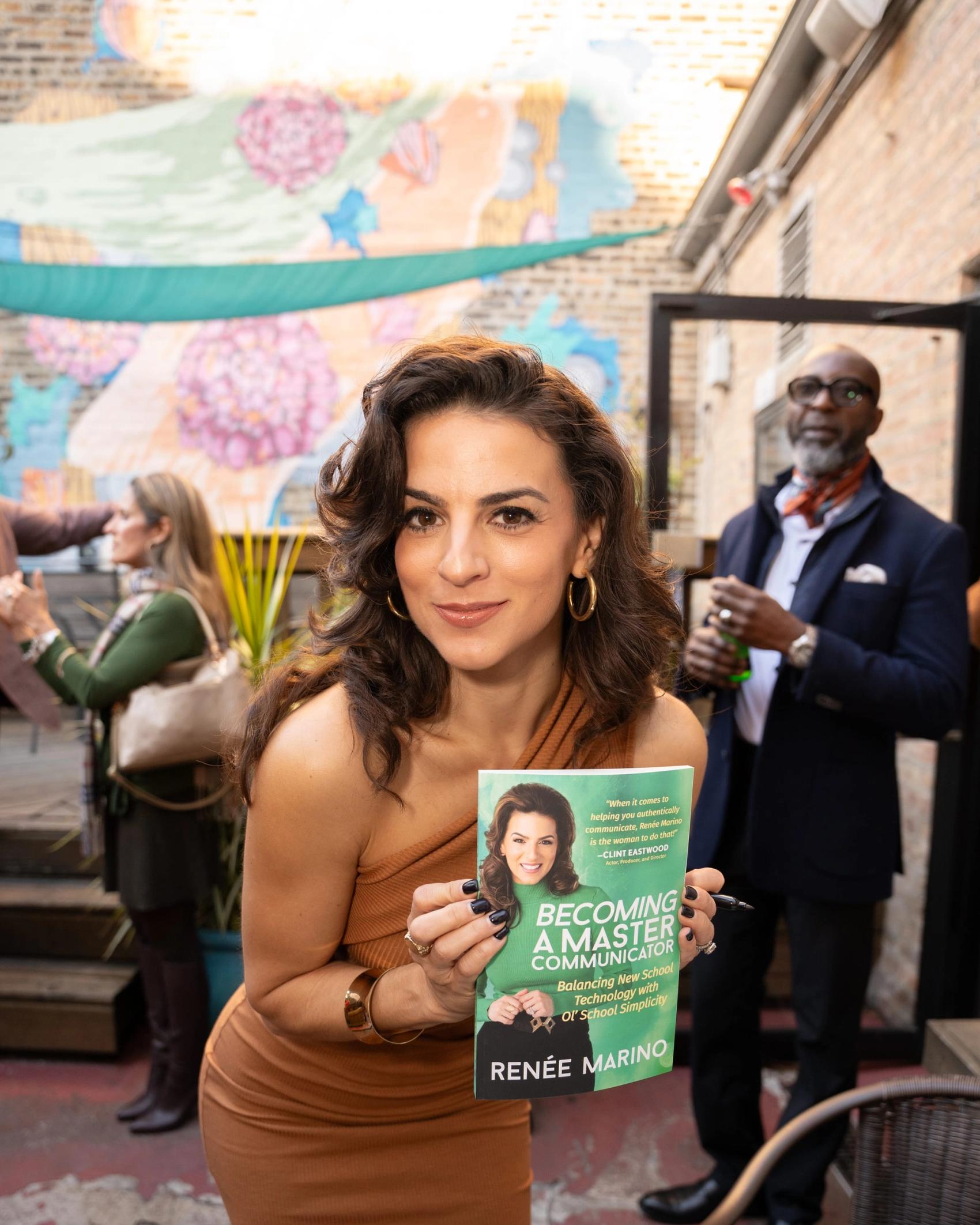 Renée Marino signing copies of Becoming a Master Communicator