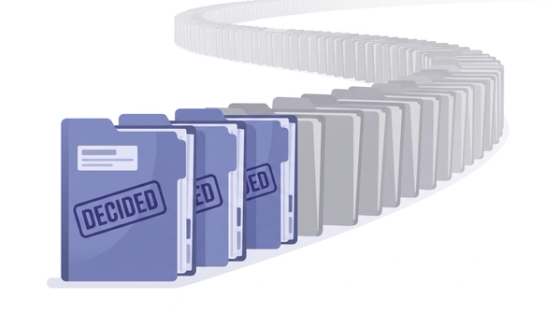 A long line of immigration case files with only the front few marked as decided, illustrating why the USCIS average processing time describes only completed cases.