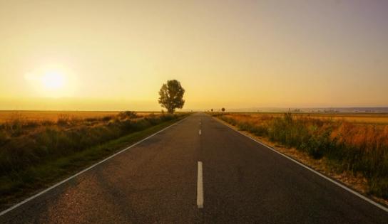 Open road at sunset symbolizing the path to citizenship despite obstacles like a DUI conviction