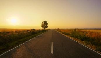 Open road at sunset symbolizing the path to citizenship despite obstacles like a DUI conviction