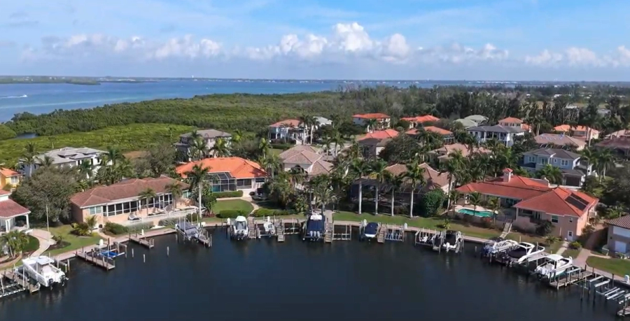 Aerial view of the canal-front neighborhood and boat docks — Custom home addition, Cortez