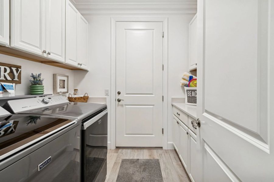 Laundry room white cabinets — Whole-home renovation, Bradenton