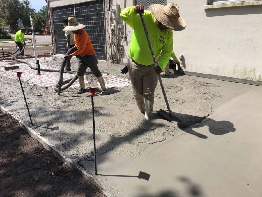 Concrete driveway pour finishing crew — Bradenton Research Center