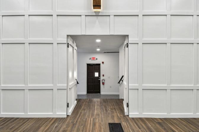 Entryway behind stage in custom sanctuary renovation by Adkins Building & Construction in Anna Maria, FL
