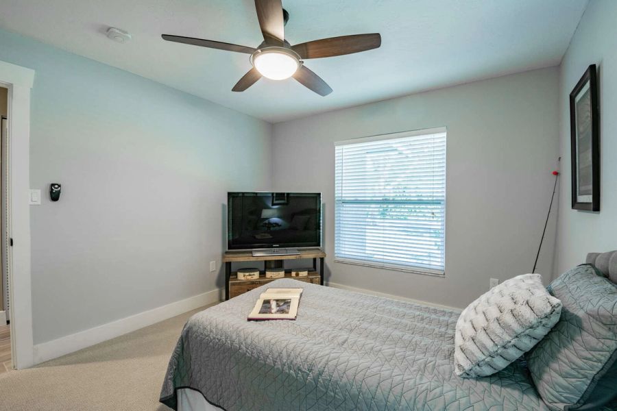 Guest bedroom ceiling fan and tv — Custom home addition, pool, and renovation, Bradenton
