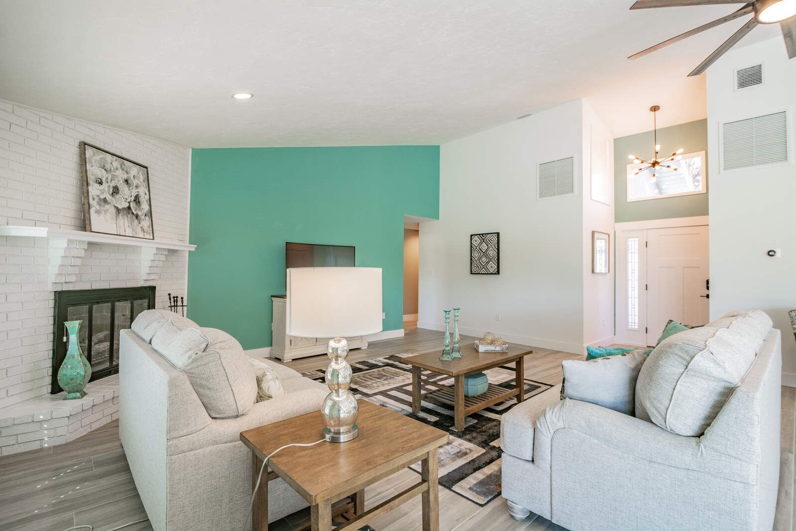 Living room with fireplace and front entry — Custom home addition, pool, and renovation, Bradenton