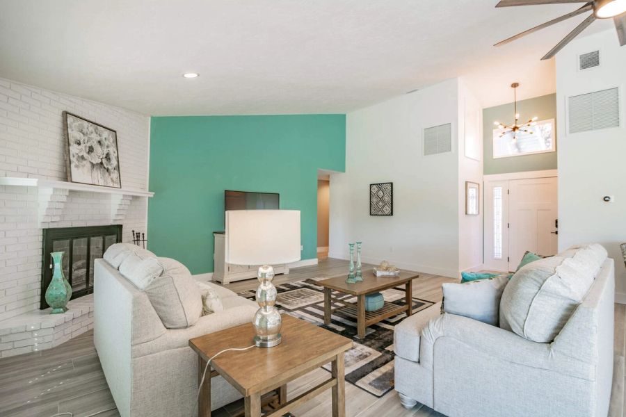 Living room with fireplace and front entry — Custom home addition, pool, and renovation, Bradenton