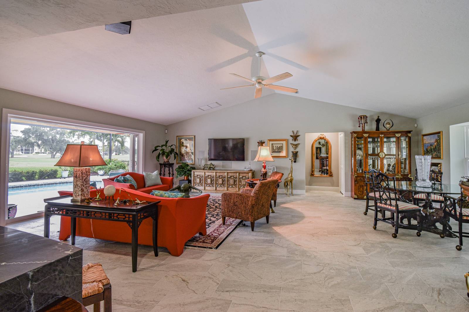 Living room red sofas decor — Custom design-build near IMG Academy, West Bradenton