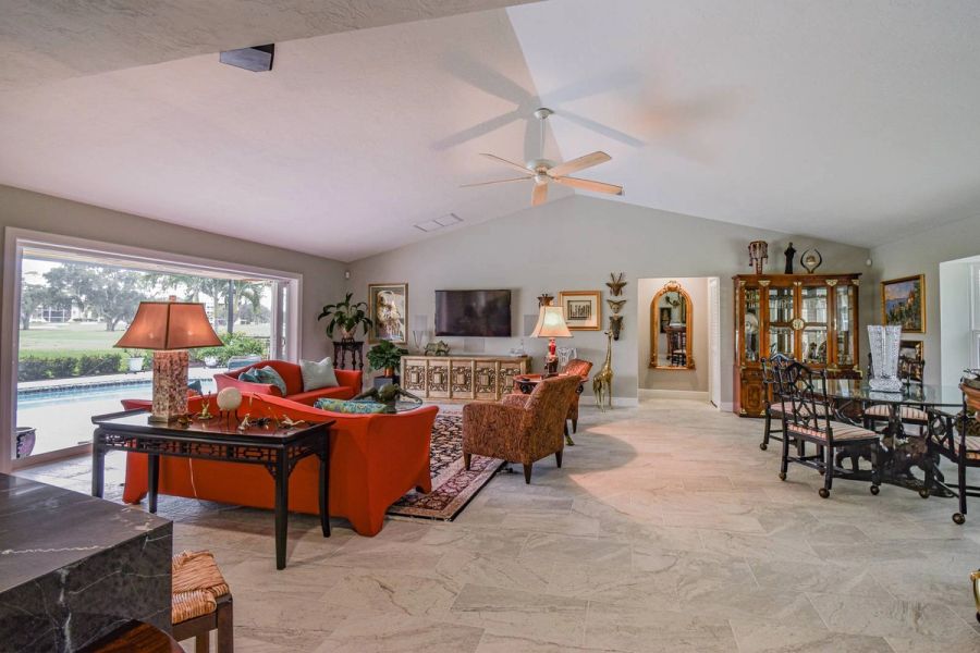 Living room red sofas decor — Custom design-build near IMG Academy, West Bradenton