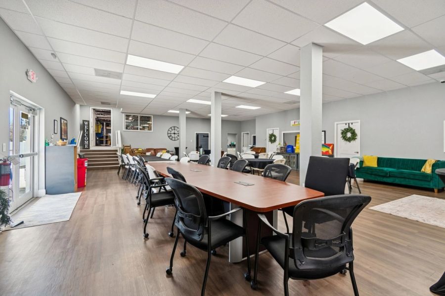Interior commercial open floor plan conference table event space wood floors — Commercial building renovation, Palmetto