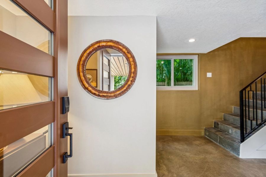 Interior ground floor entry modern wood door — Custom home addition, Longboat Key