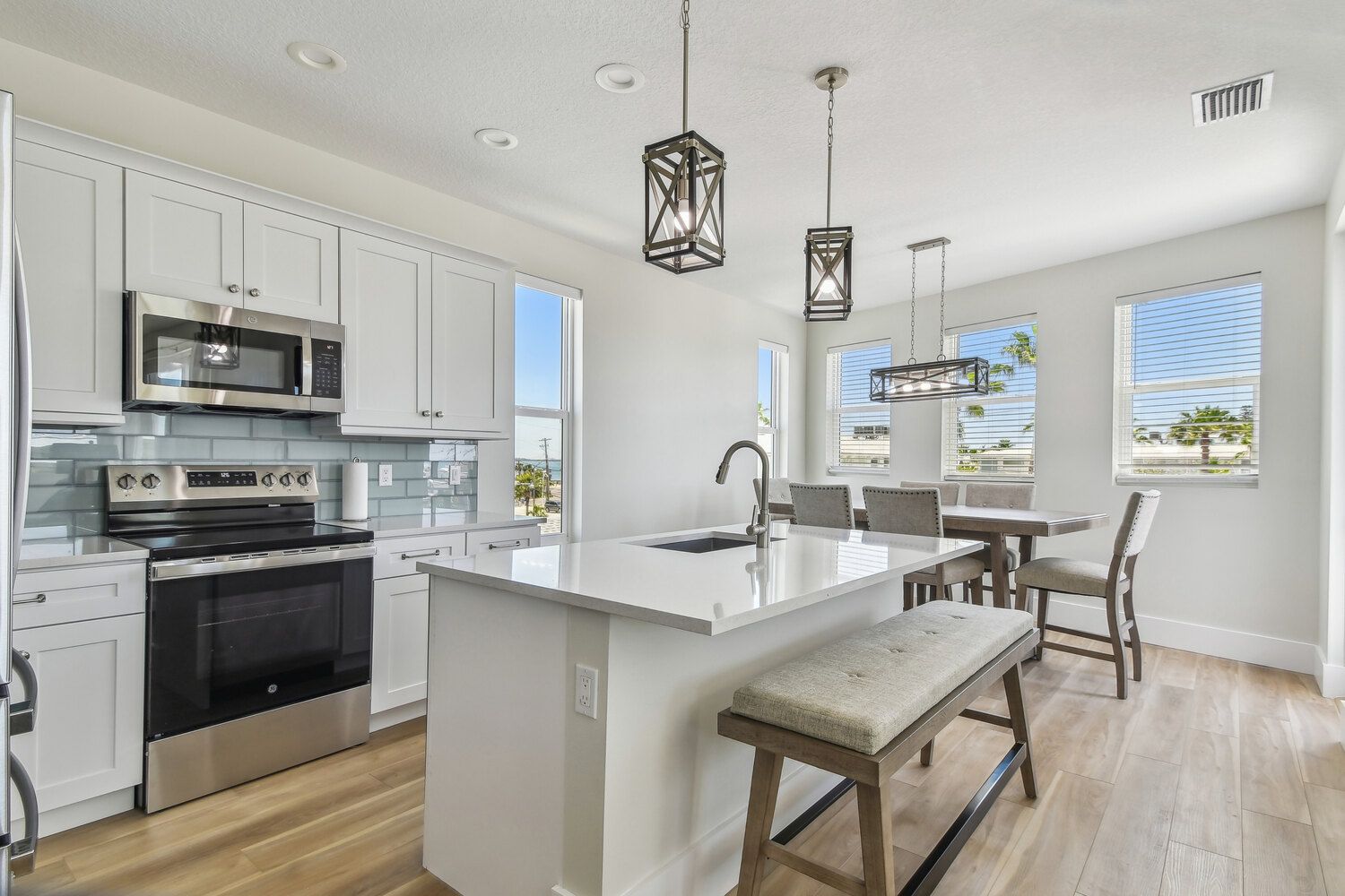 Open kitchen and dining space — Coastal custom home, Bradenton Beach