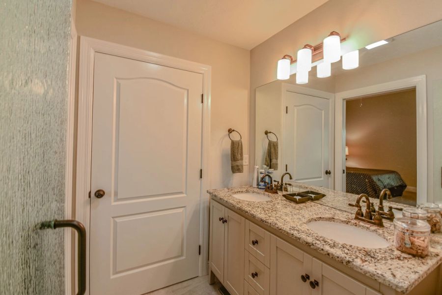 Guest bath vanity mirror view — Custom design-build near IMG Academy, West Bradenton