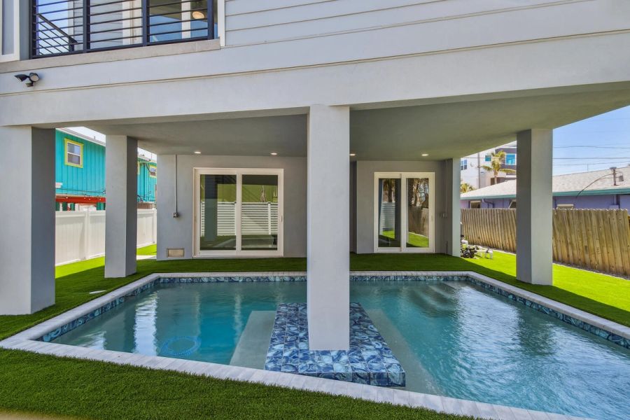 Covered poolside patio — Coastal custom home, Bradenton Beach