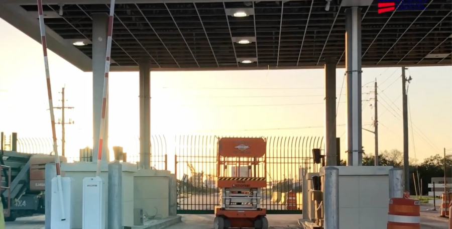 Gate lanes under the new canopy at sunset during construction — Port Manatee North Gate Expansion