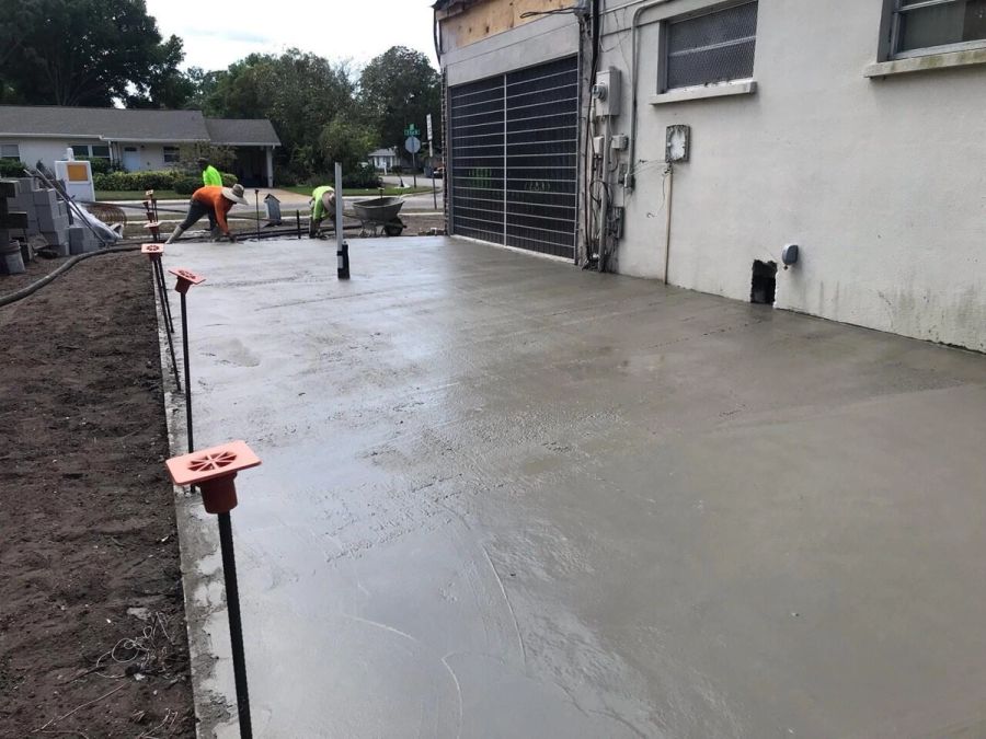 Concrete slab finishing near garage — Bradenton Research Center