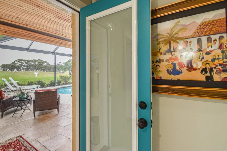 Teal front door courtyard art — Custom design-build near IMG Academy, West Bradenton